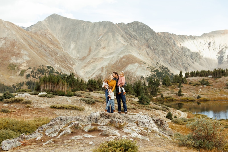 Family Photography, Family standing in front of mountains, parents kissing