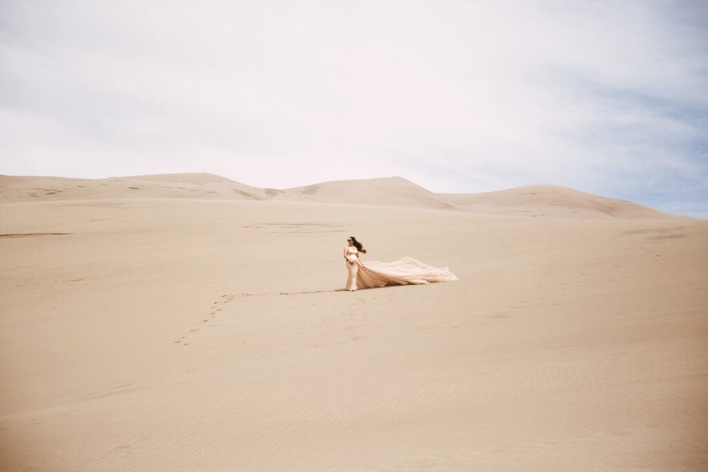 Maternity Photography, Pregnant woman in tan dress on the sand dunes
